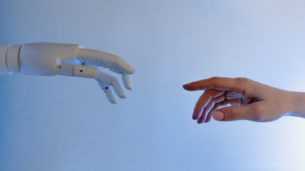 human hand reaching out to a robotic hand